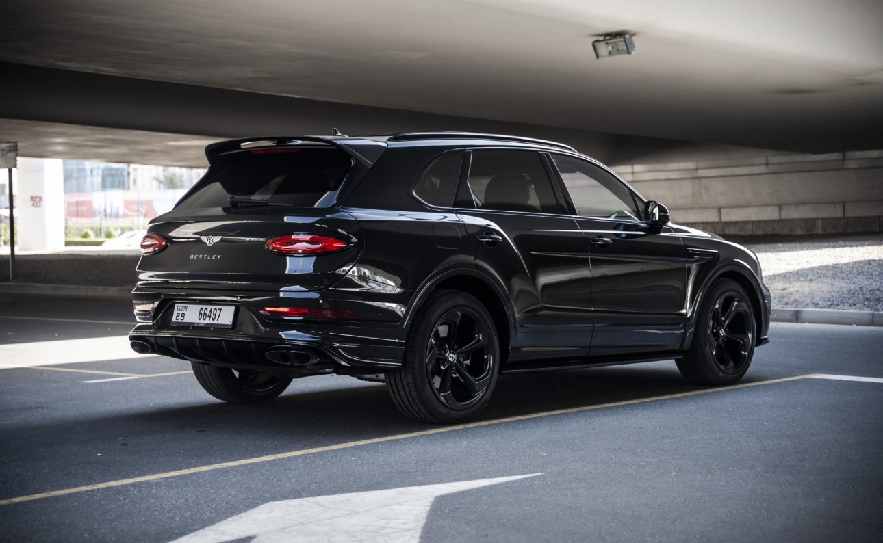 Black Bentley SUV parked in an underground parking garage