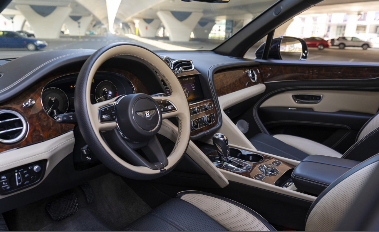 Luxurious Bentley SUV interior with wood trim and leather seats