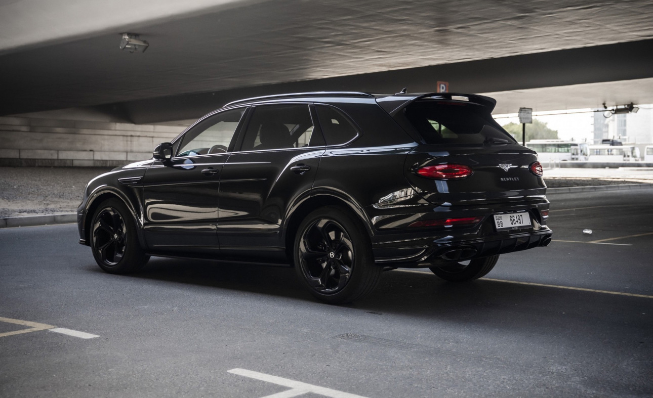 Black Bentley SUV parked in an underground parking garage