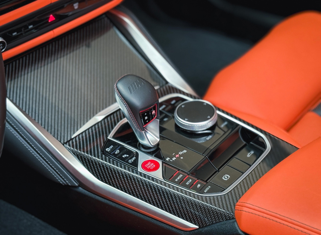 BMW M-series gear shifter with carbon fiber console and red details