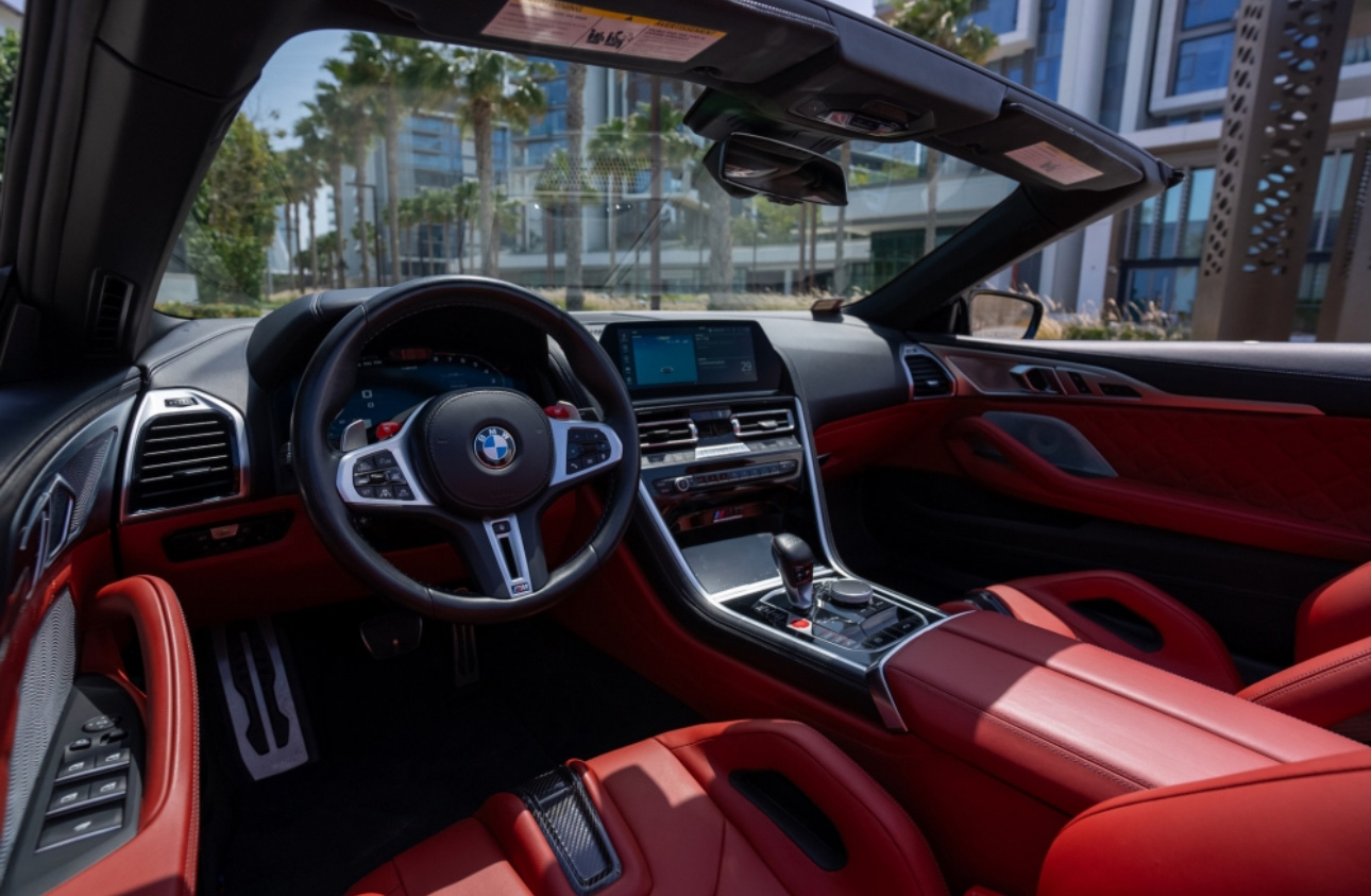 BMW interior with red leather seats and modern dashboard view