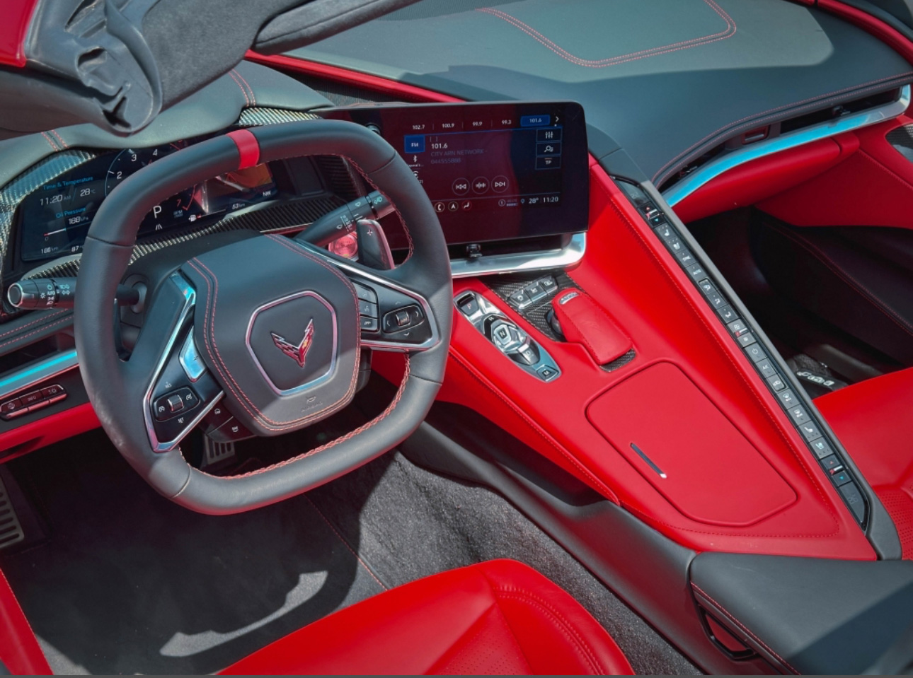 Modern Corvette interior with red leather and digital dashboard