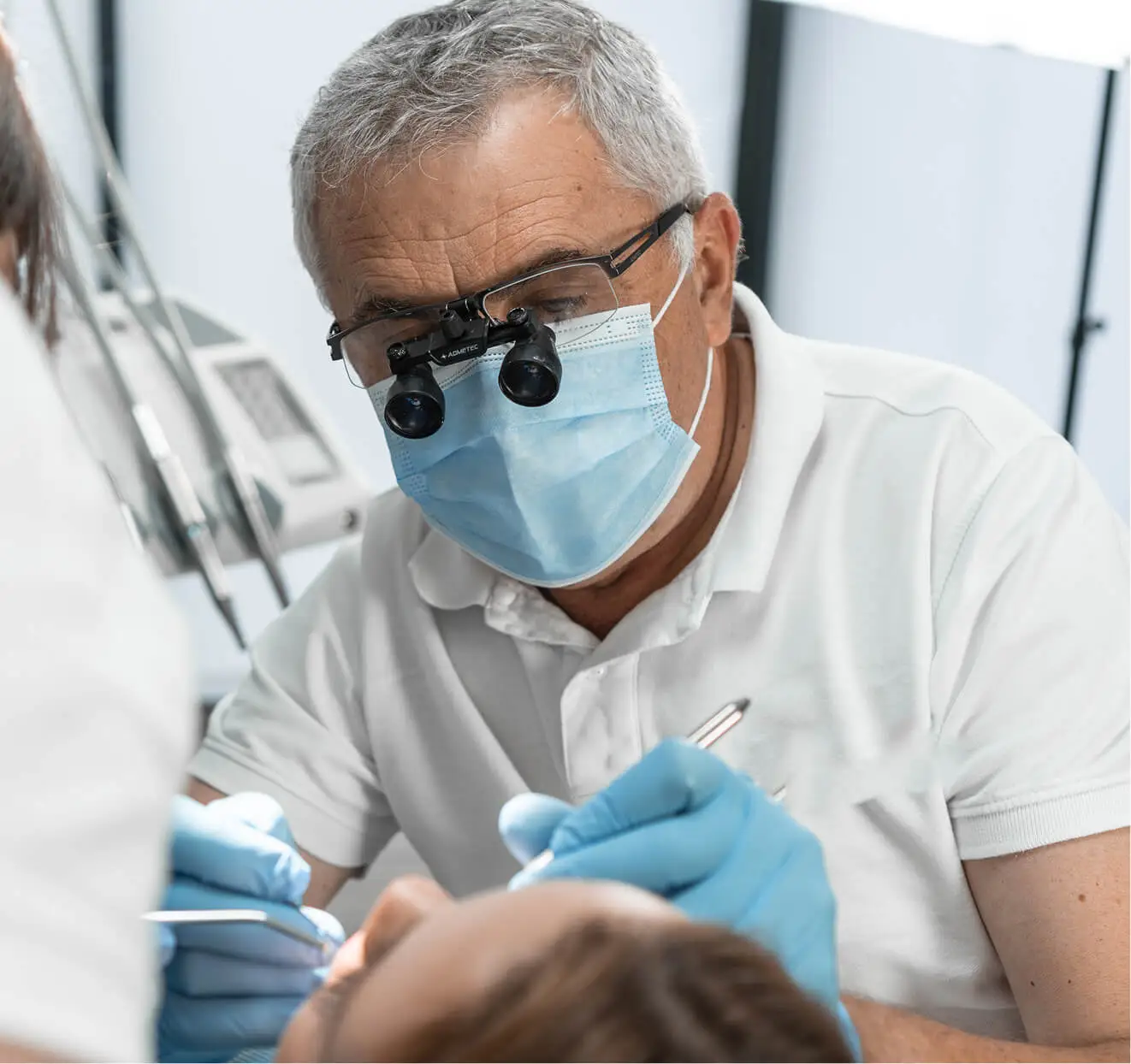 Emergency dental care with dentist in PPE