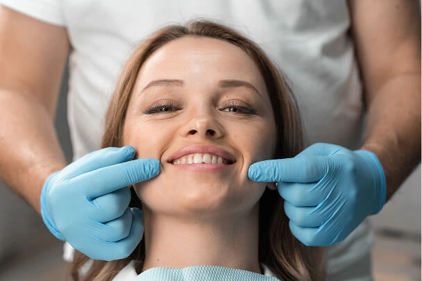 Routine dental check-up with smiling female patient