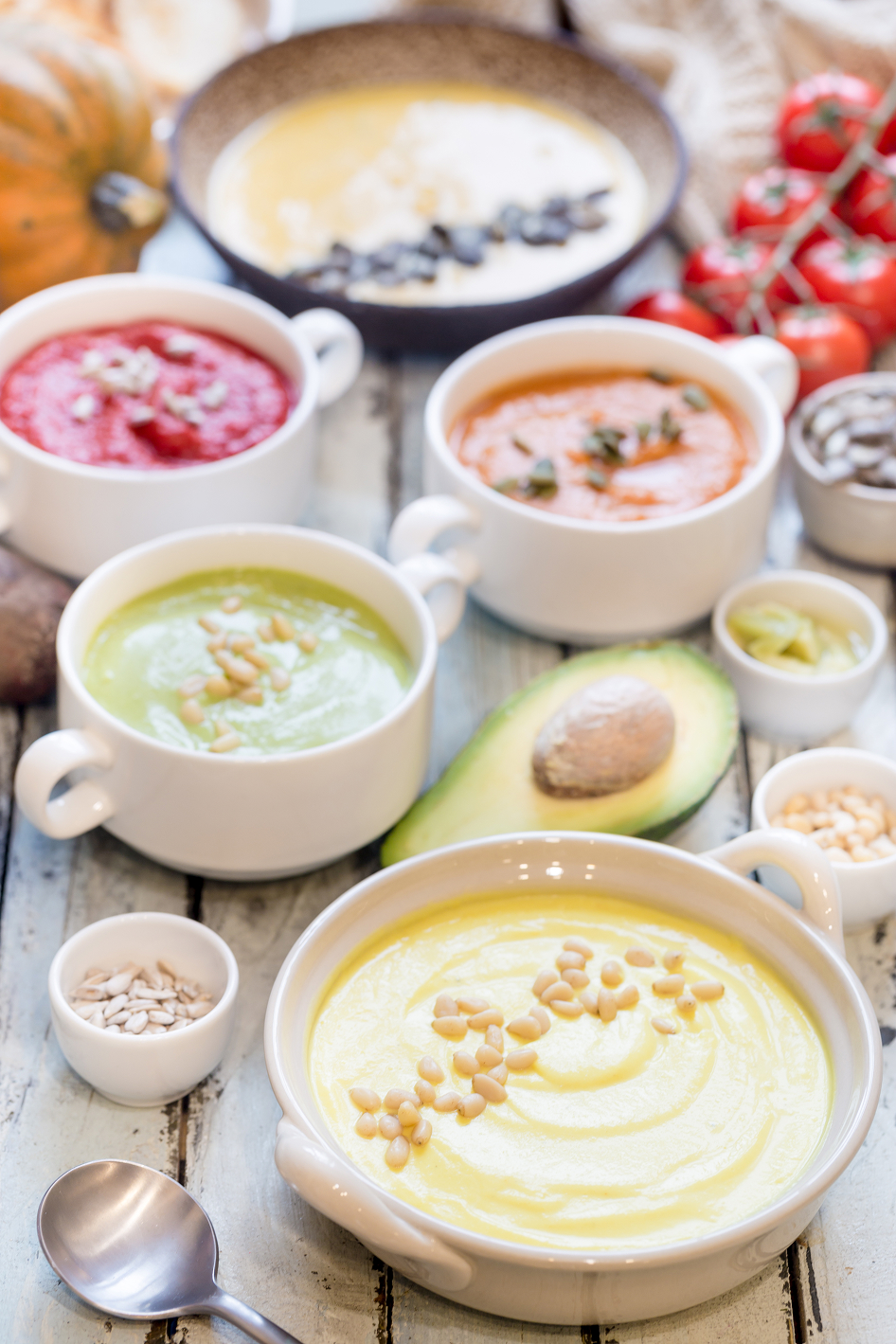 Assorted colorful healthy foods in bowls, highlighting nutrition that supports oral health.