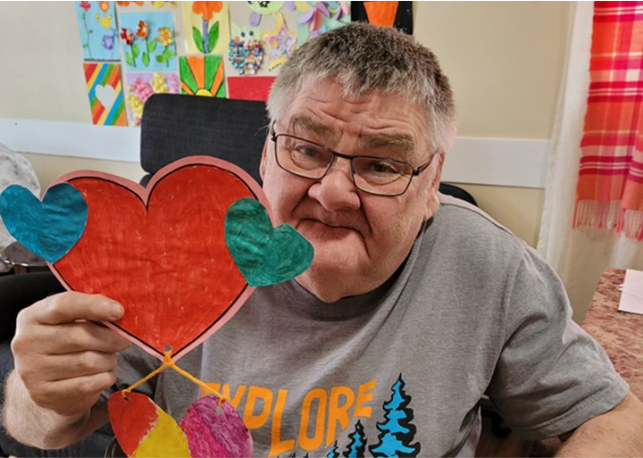 Client with paper heart.