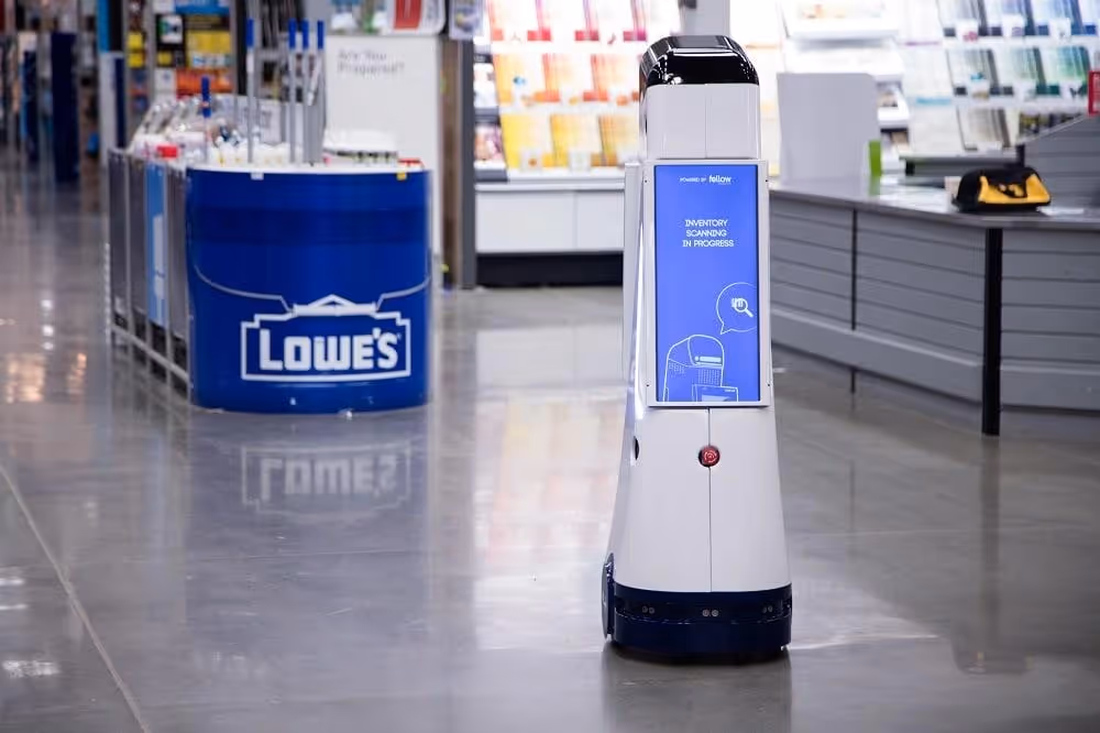 Lowebot assisting customers in Lowe's retail store.