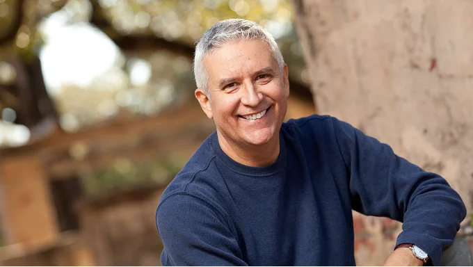 Close-up portrait of a smiling House Account handyman service provider.