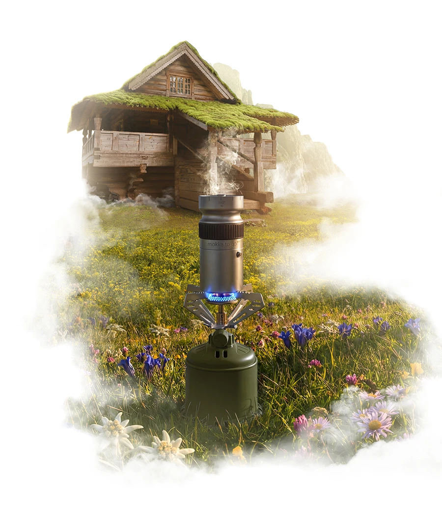 Camping stove with steaming pot in a misty mountain meadow.