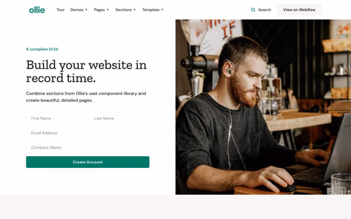 Man with earphones focused on laptop in a cozy café next to a website signup form.