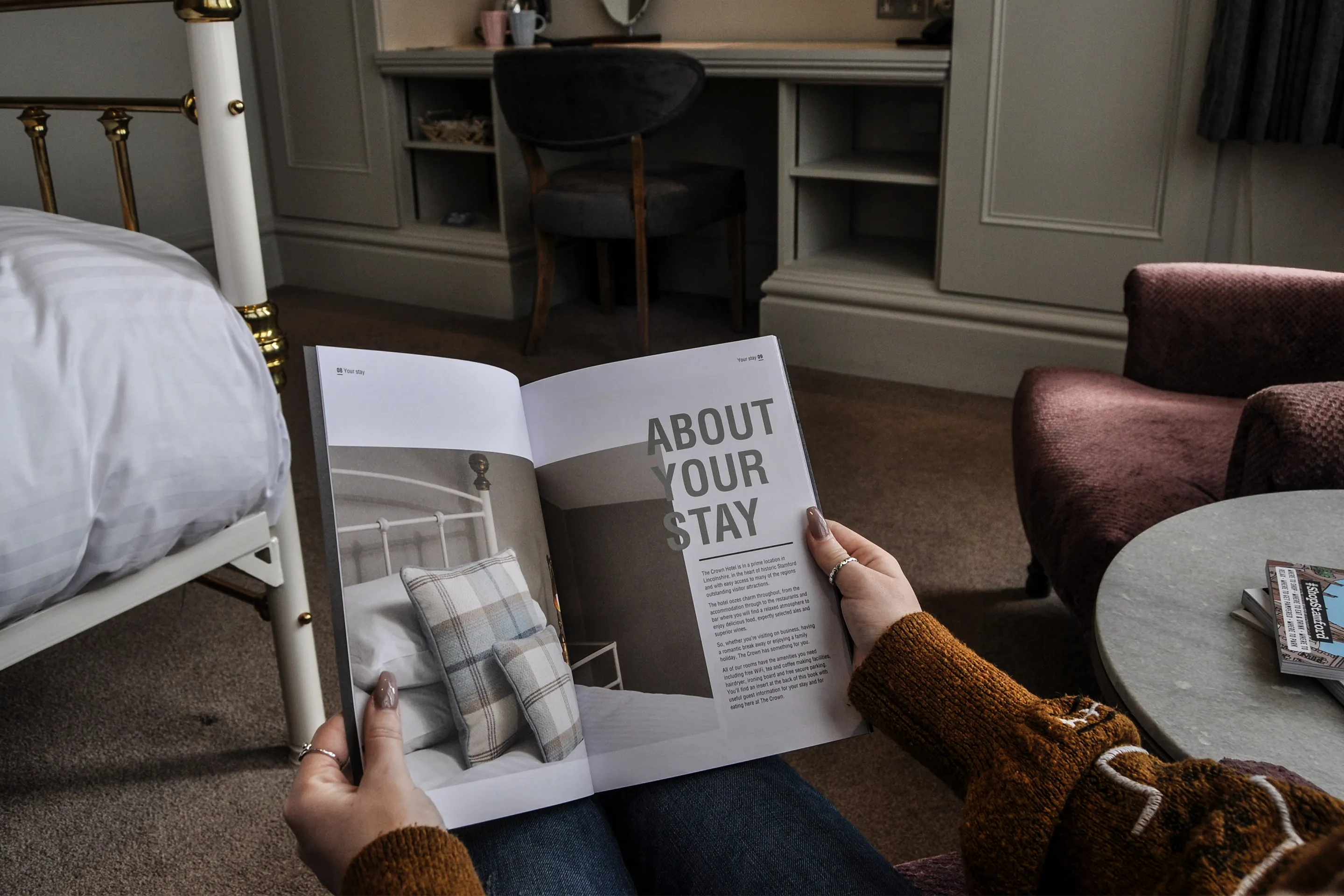 brochure being held by person in a hotel room