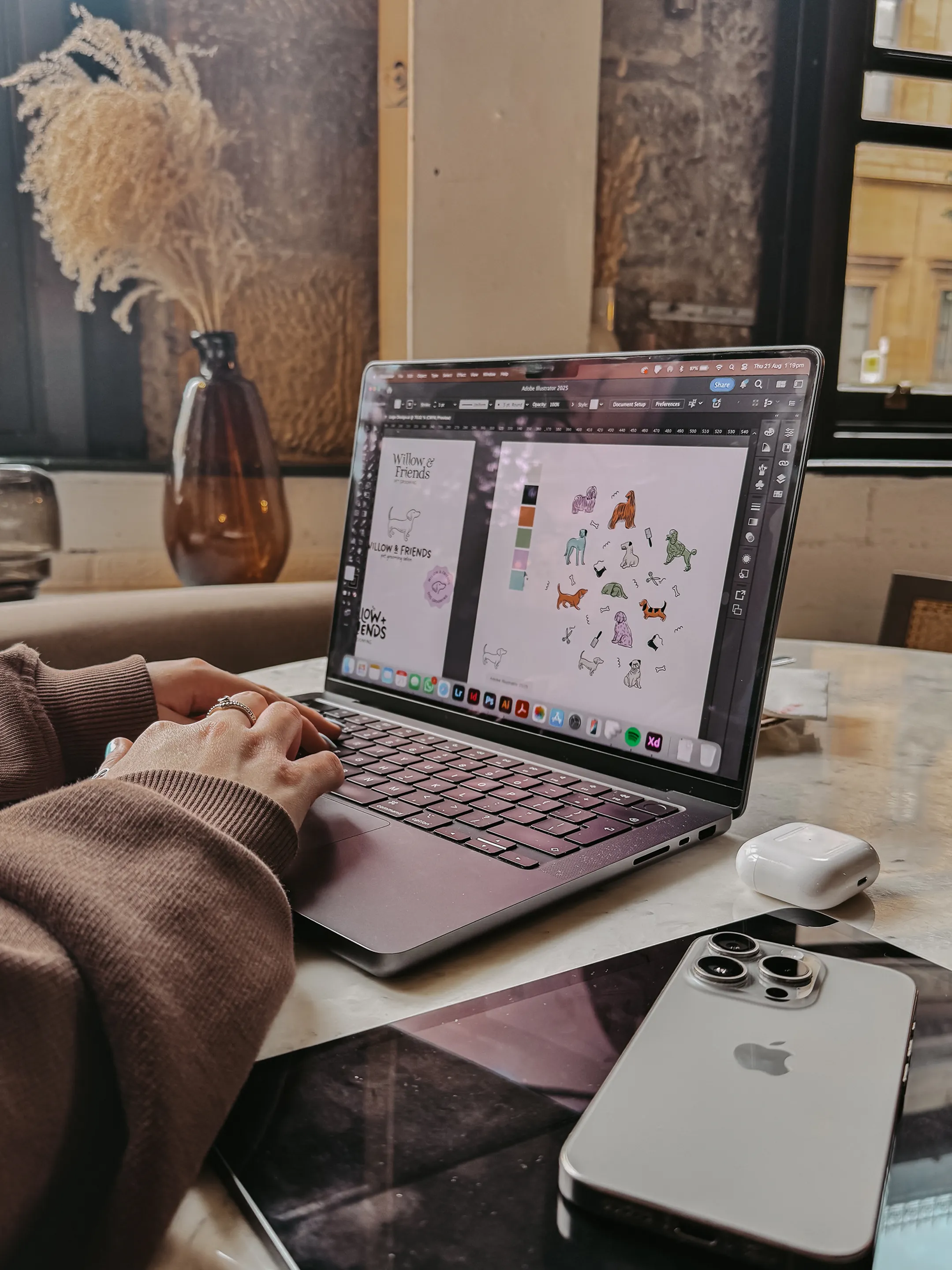 Young woman working on laptop creating illustrations