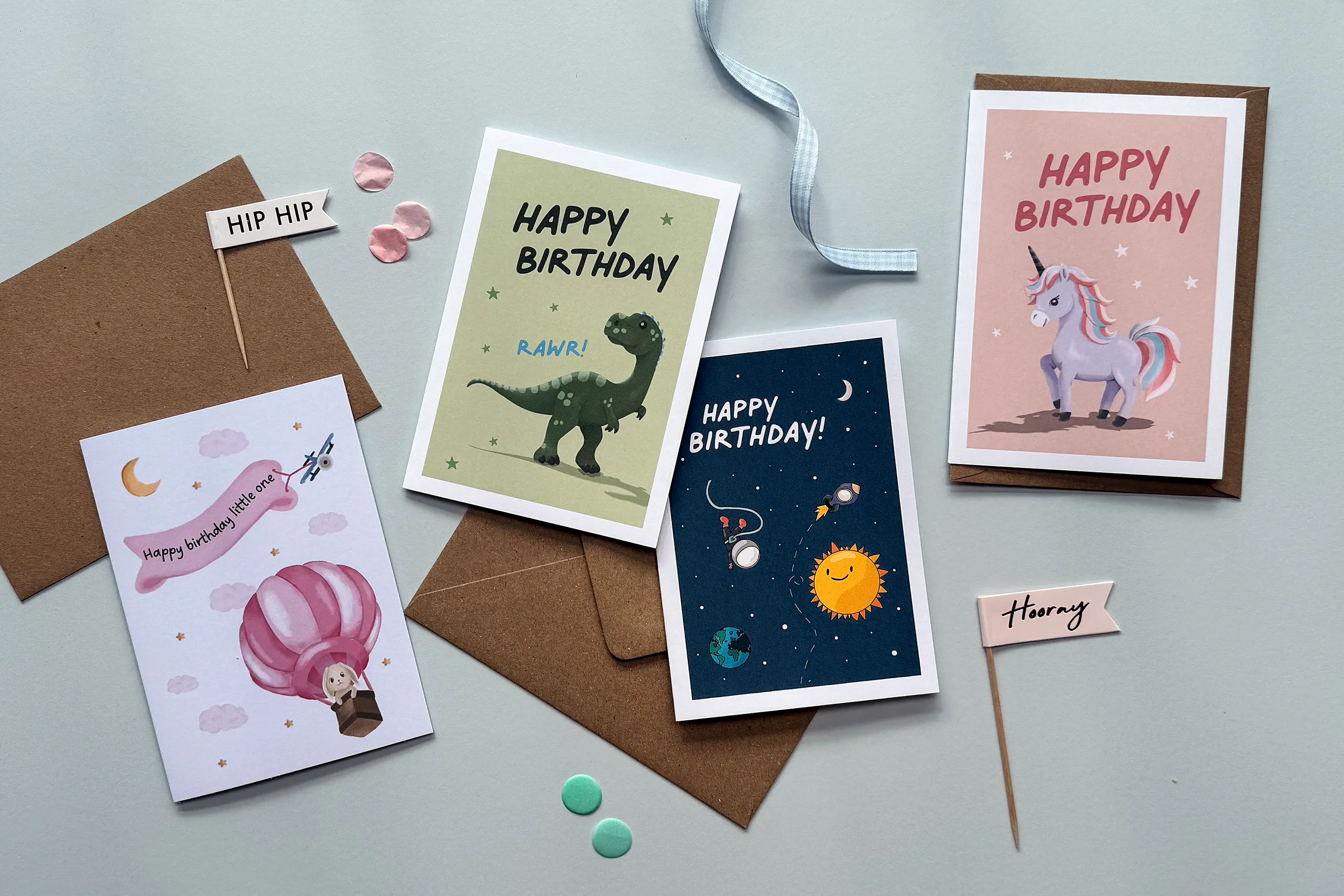 greetings card collection laid out with birthday accessories
