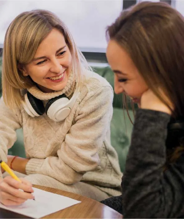 Teacher helping student