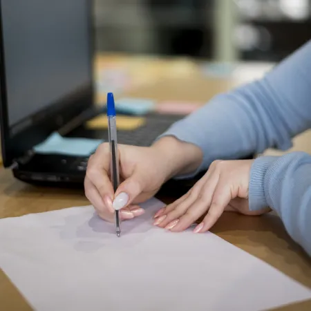 Student writing notes