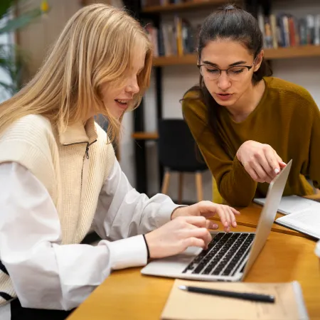 Teacher helping with computer work