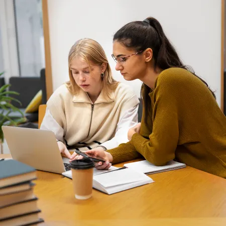 Teacher helping student