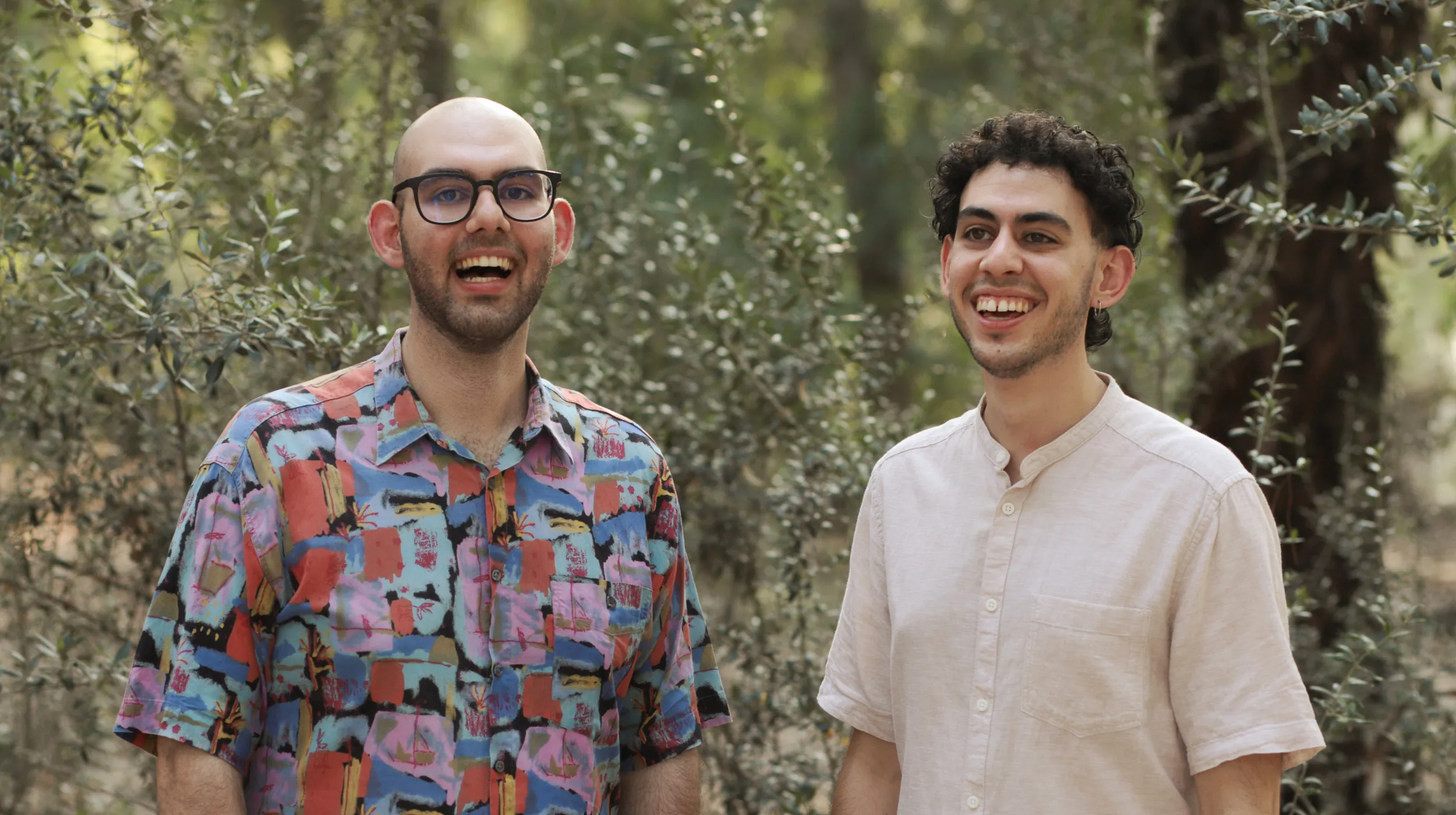 Savvas, founder and art director, standing next to Antonis, web and digital lead, smiling together