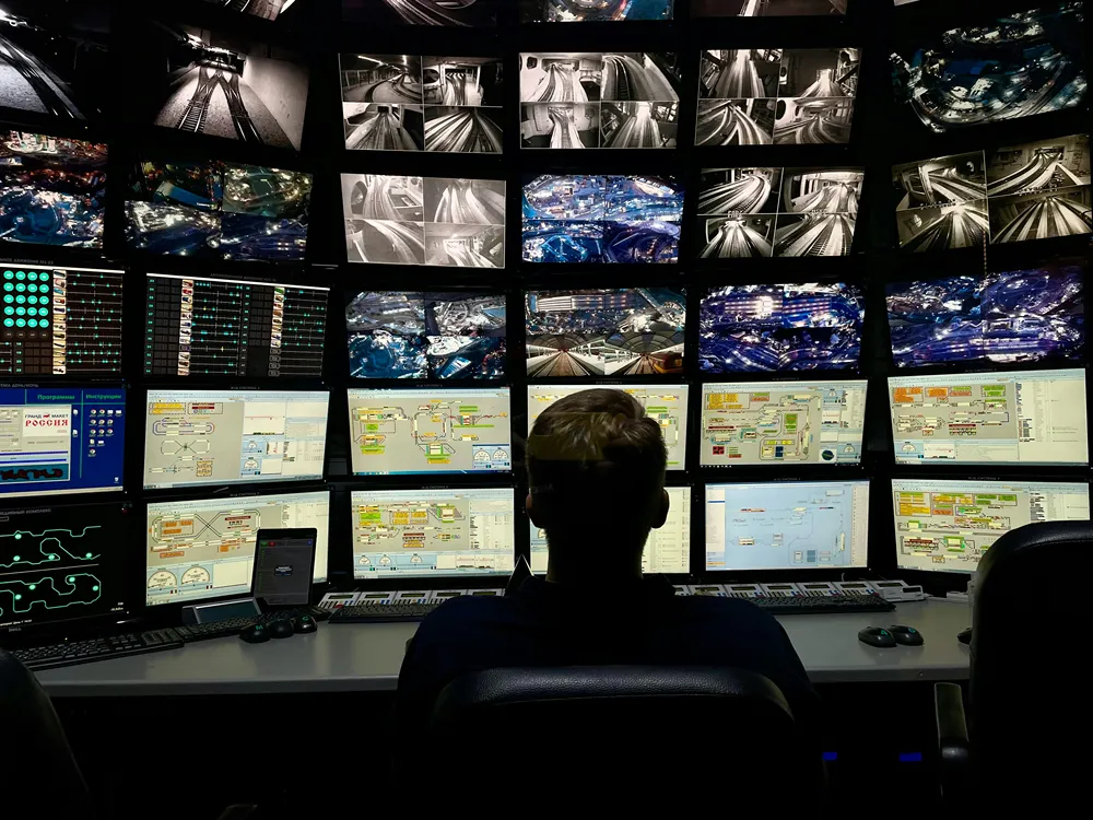 Engineer monitoring an AI agent in production across multiple screens