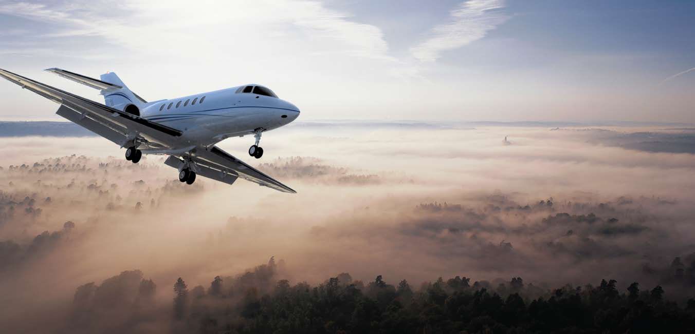 Hawker Beechcraft 750 flying over clouds