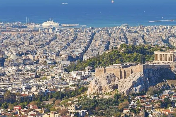 Athens with the Acropolis and its Parthenon with the sea and yachts in the background