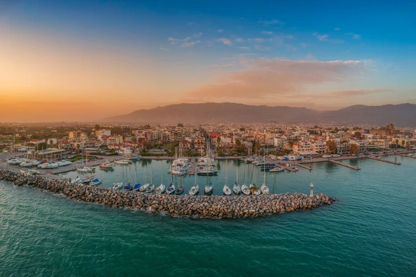 Idyllic landscape flying above Kalamata's Marina at sunset. Aerial photography of Kalamata city, Messenia, Peloponnese, Greec