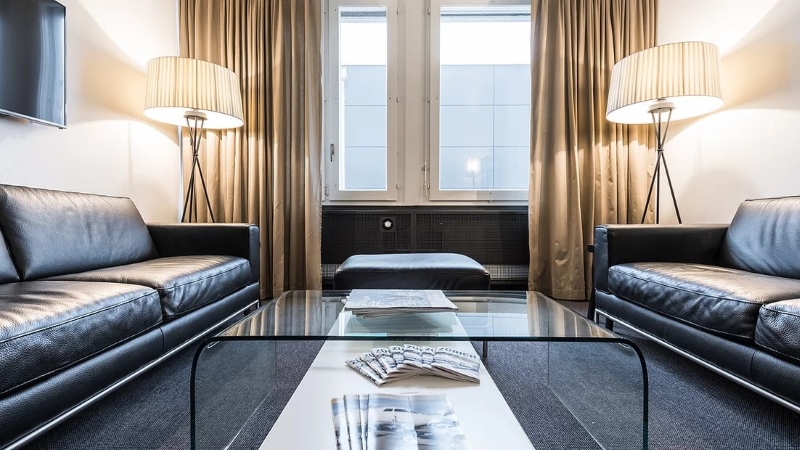 Cat Air Service FBO lounge at Zurich Airport with leather seating and a quiet setting for private aviation passengers.