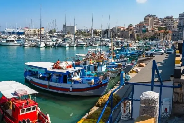 Photo of the port of Iraklion in Greece where many boats are moored.
