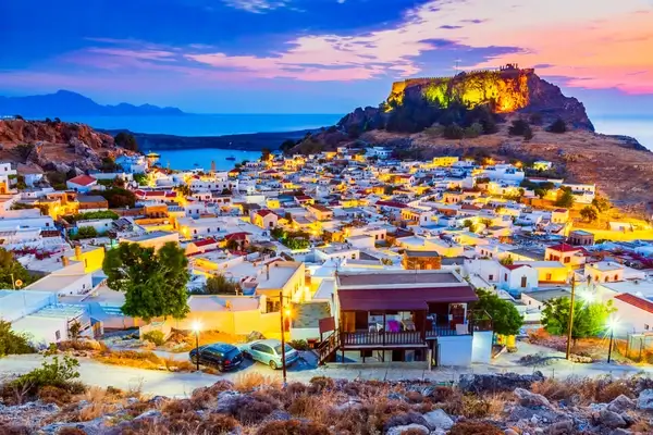 Rhodes, Greece. Lindos small whitewashed village and the Acropolis, scenery of Rhodos Island at Aegean Sea.
