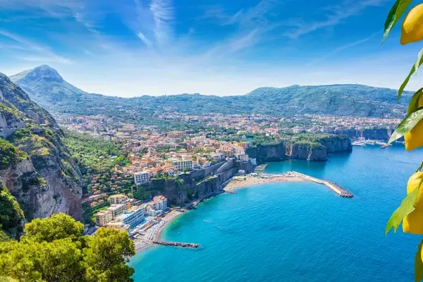 Aerial view of cliff coastline Sorrento and Gulf of Naples, Italy. Ripe yellow lemons in foreground. In Sorrento lemons are u