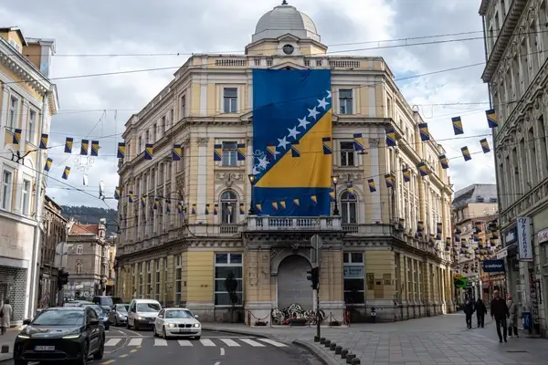 City street in Sarajevo adorned with Bosnian flags