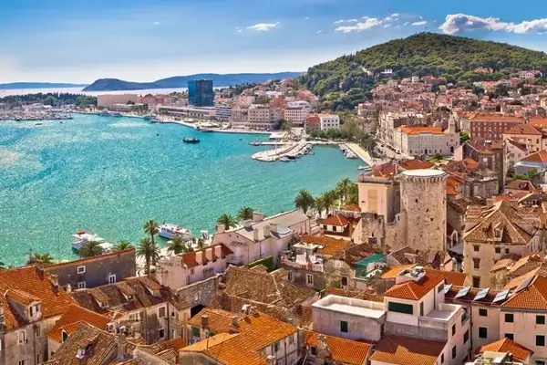 View of the port of Split in Croatia with its turquoise waters, a cruise ship is moored there.