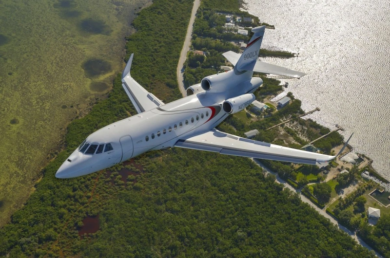 Falcon 900LX, a green jet in the air