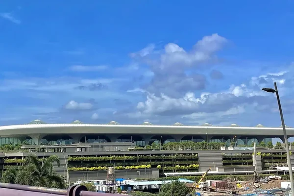 Terminal 2 at Chhatrapati Shivaji Maharaj International Airport in Mumbai, with its broad roof and landscaped exterior