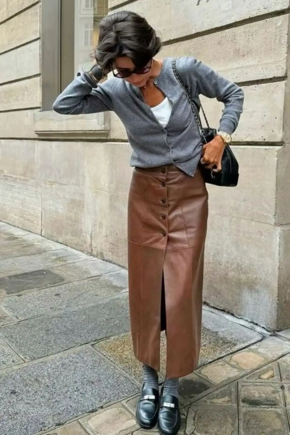Street style look with brown vintage leather midi skirt and soft knit, showing the leather pencil skirt as a timeless wardrobe anchor.