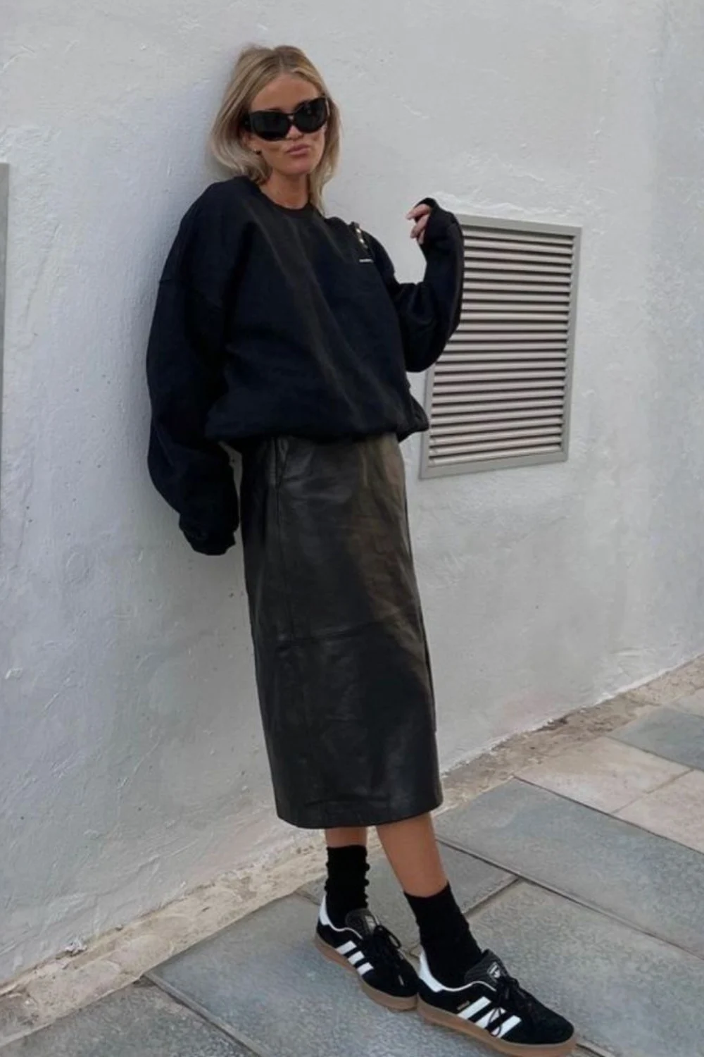 Street style look with burgundy leather midi skirt and shirt, showing how a real leather skirt adds structure and confidence to daily outfits.