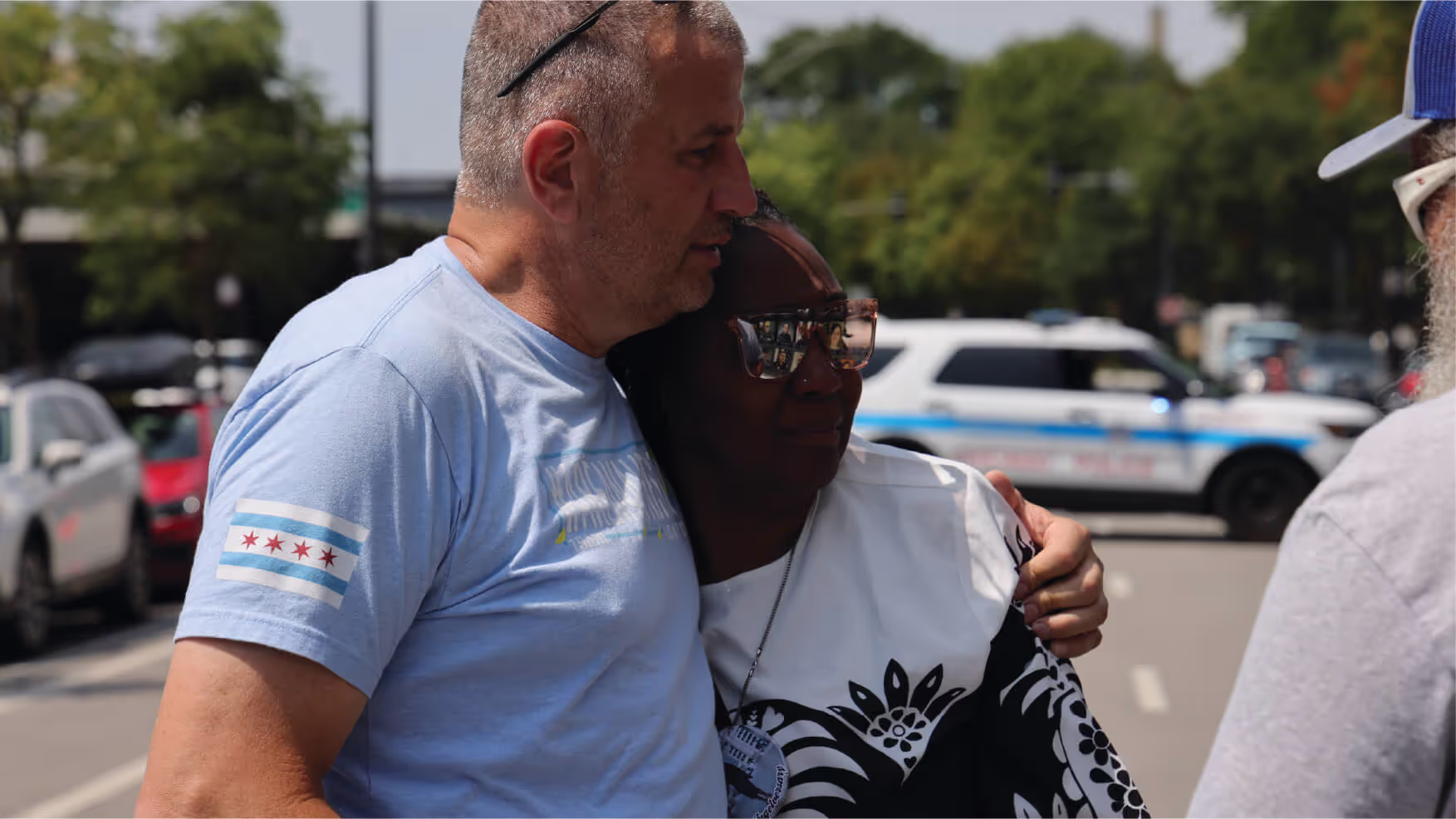 Officer hugging woman