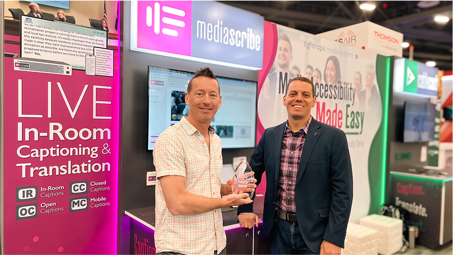 Tightrope CEO, JJ Parker, in MediaScribe booth at Las Vegas Convention Center holding TV Tech Best of Show Award.
