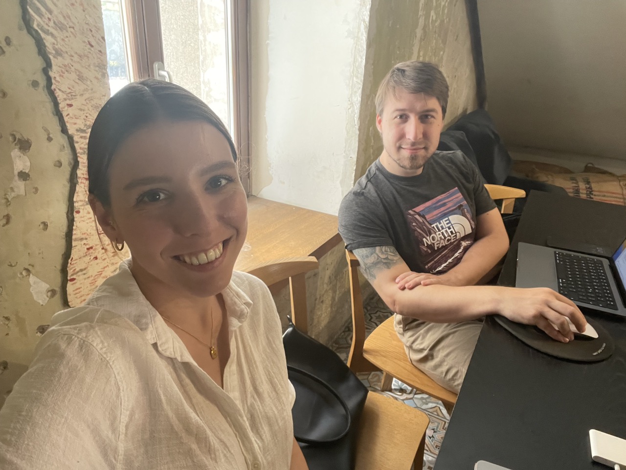 A man and a woman by the window.