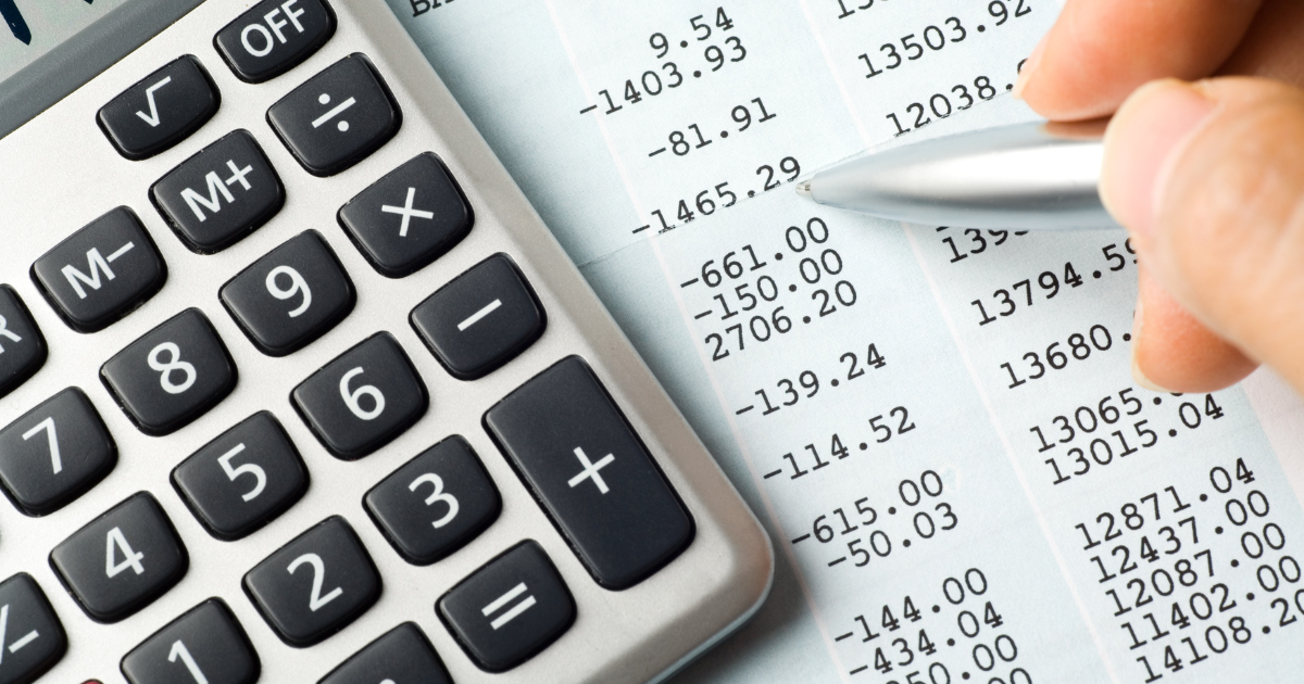 Close-up of a calculator and financial statement representing international accounts payable reconciliation, invoice processing, and secure payment automation.
