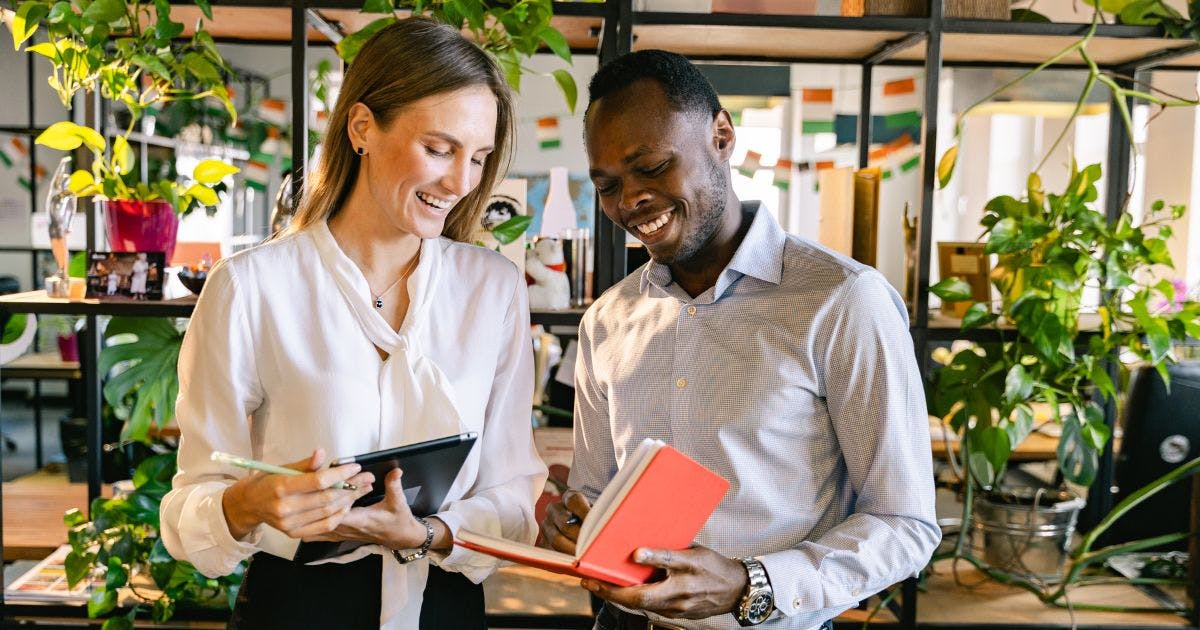 Employees reviewing reimbursement guidelines and discussing policy updates