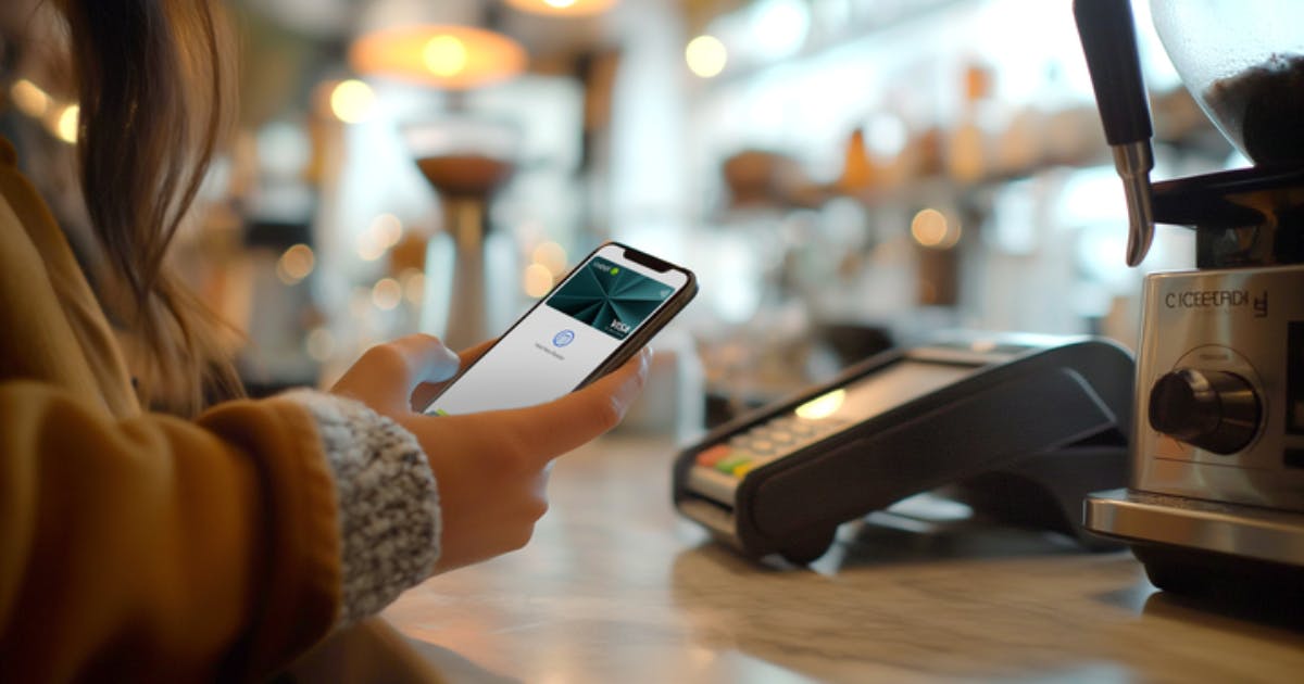 A mobile phone with a Weel virtual card tapping on a payment terminal, showcasing the future of petty cash book software with real-time expense tracking.