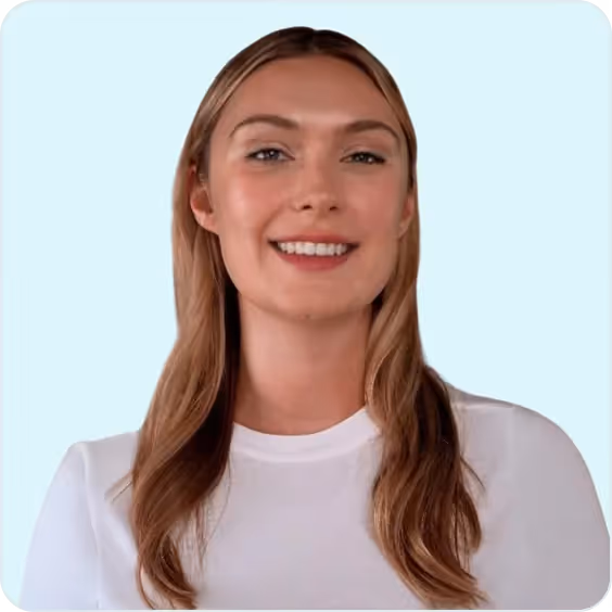 Mikayla Frank, Director of Business Development at PatientPartner, smiling in a light blue background portrait