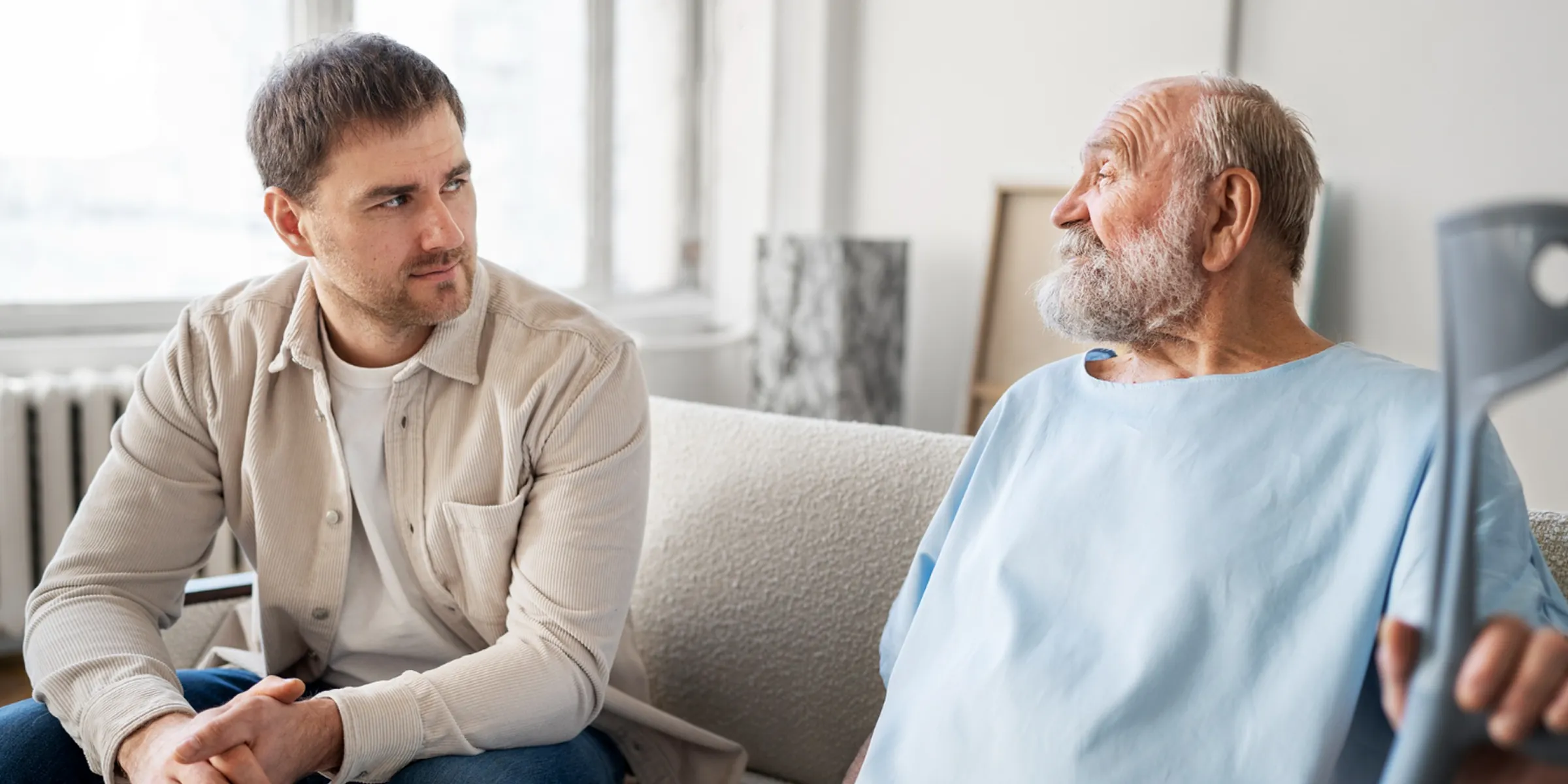 Senior patient and caregiver discussing care plan supported by digital patient engagement platform.