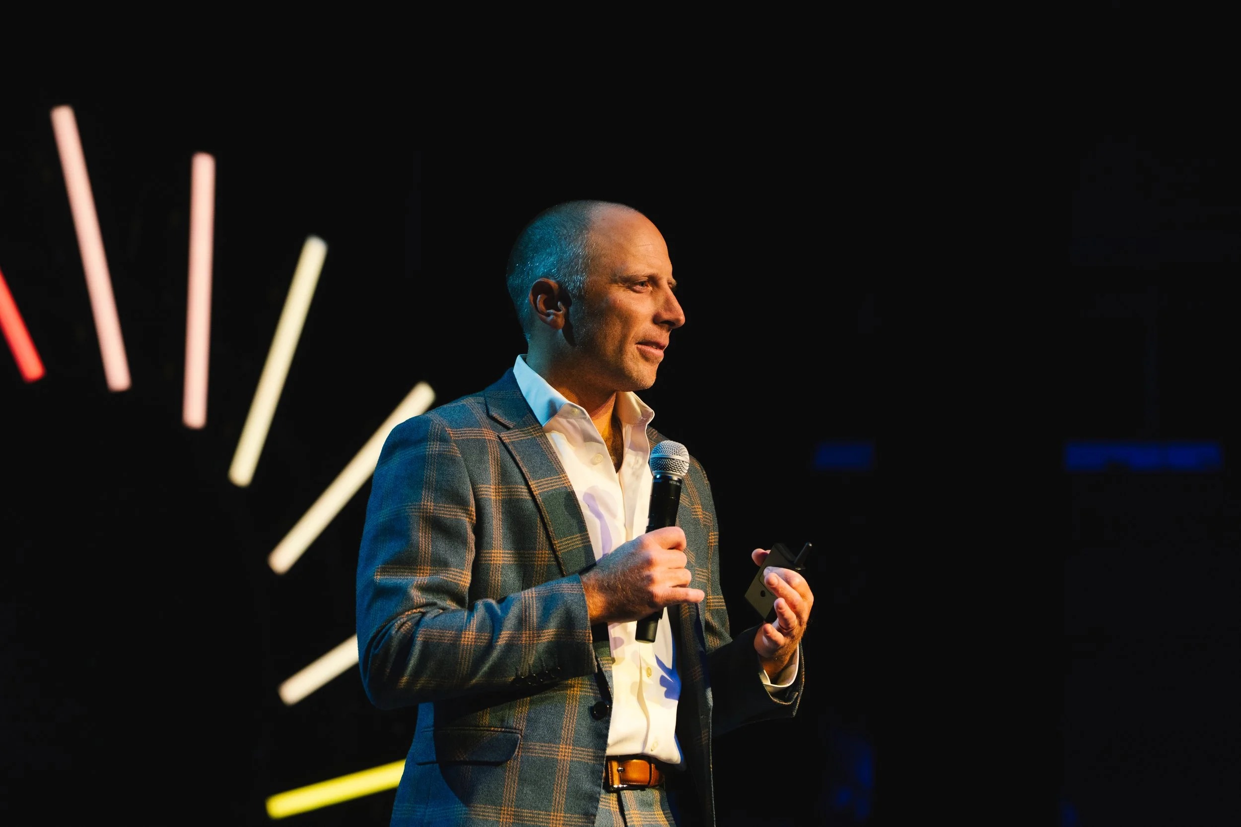 Nurse using patient engagement software to support an older patient and caregiver with compassionate, HIPAA-compliant care.