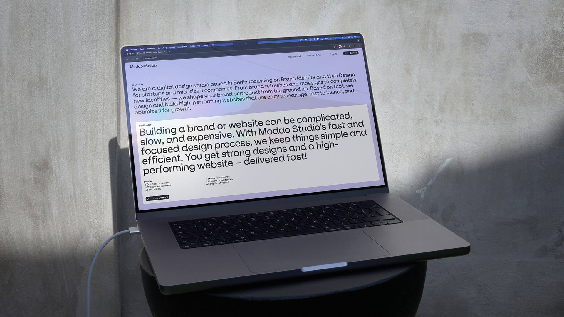 A laptop showing the website of the client.