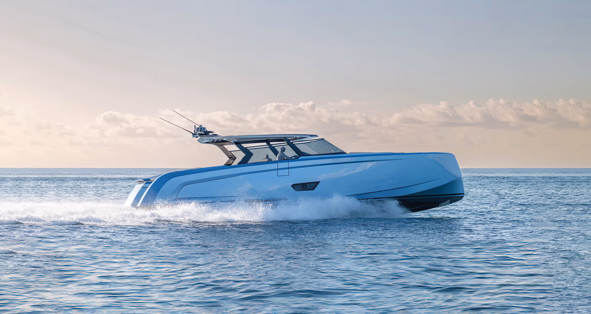 Modern luxury yacht vanquish 58 t-top cruising at high speed on a calm sea during sunrise.