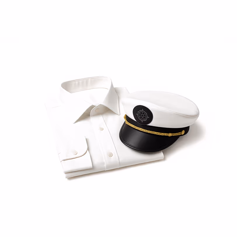 Folded captain uniform with hat representing handpicked professional yacht crew.