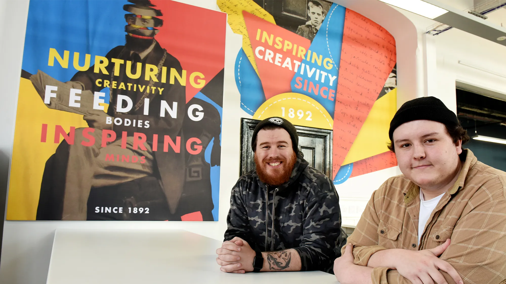 Rob and Ciaran Photo Infront of Murals