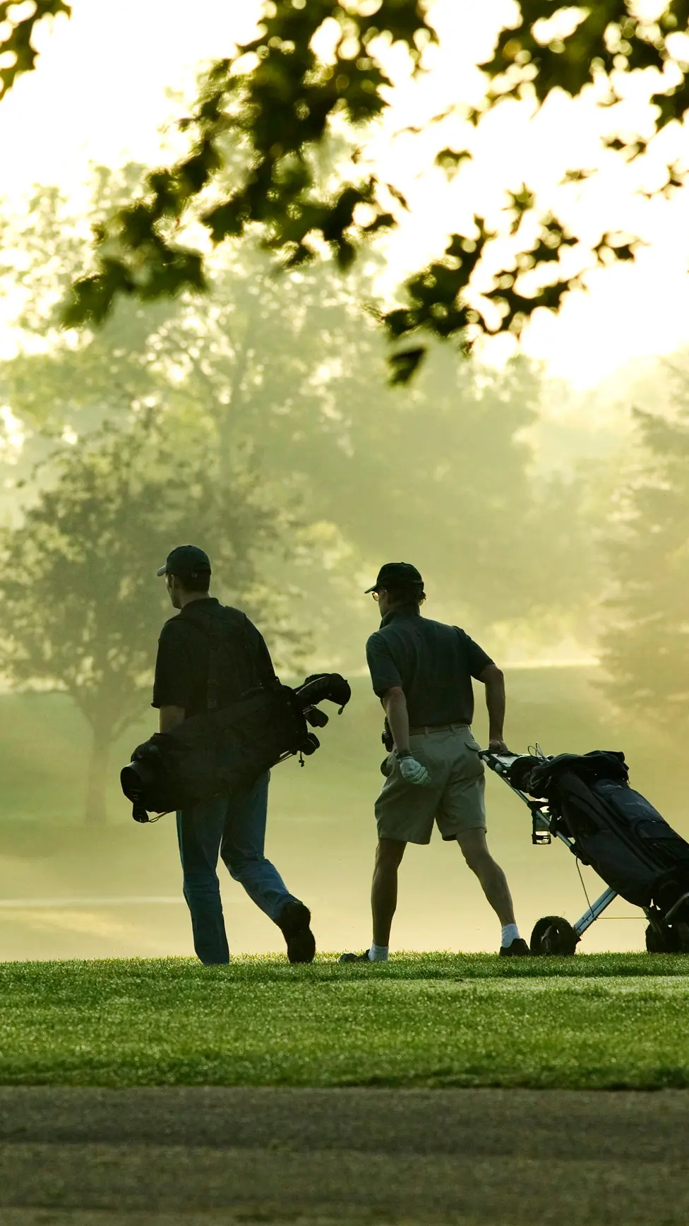 Golfer walking on a golf course equipped by Qovoltis